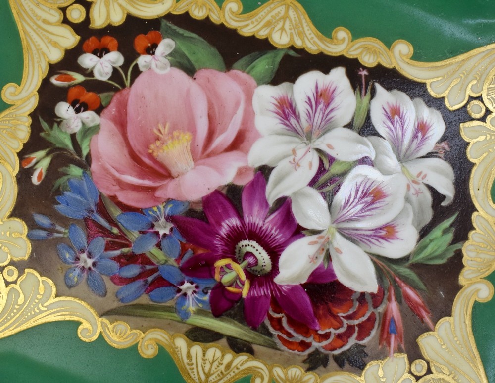 A rectangular green porcelain tray with elaborate gold scrollwork framing a hand-painted botanical bouquet in the centre. View VI