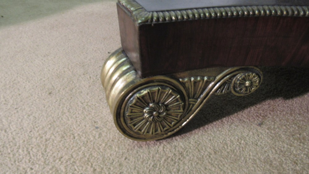 A circular Regency rosewood tilt-top loo table featuring brass marquetry inlay along the perimeter and a pedestal base. View VIII