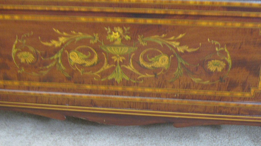 An Edwardian fiddleback mahogany display cabinet featuring glazed doors, detailed floral marquetry inlay on the lower panels, and square tapered legs. View XIV