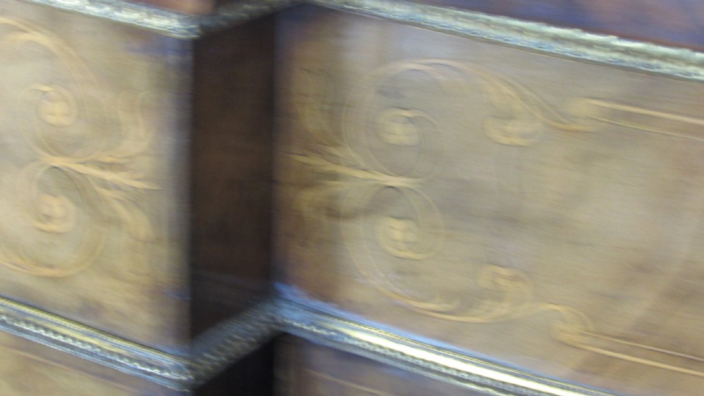 A Victorian burr walnut credenza featuring a central inlaid panel door flanked by two curved glazed display cupboards with gilt brass mounts. View XXII