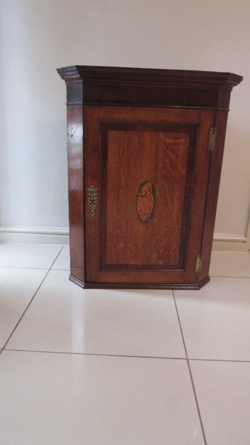 Georgian oak and mahogany corner cupboard