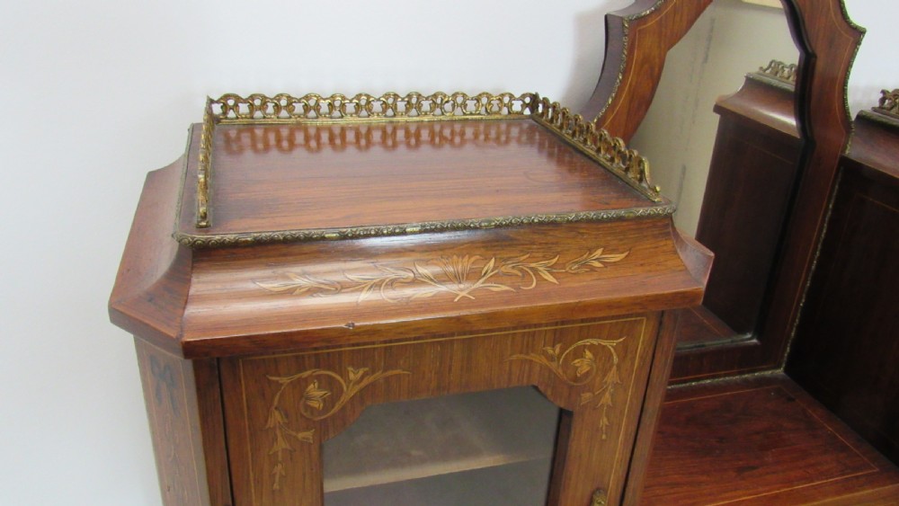 An antique French-style walnut writing bureau with floral marquetry, cabriole legs, brass mounts, and a upper cabinet section featuring small glazed doors and a central mirror. View V
