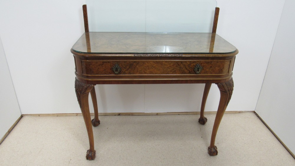 An antique burr walnut side table featuring cabriole legs with claw and ball feet, a single drawer, and a fitted glass top insert. View II