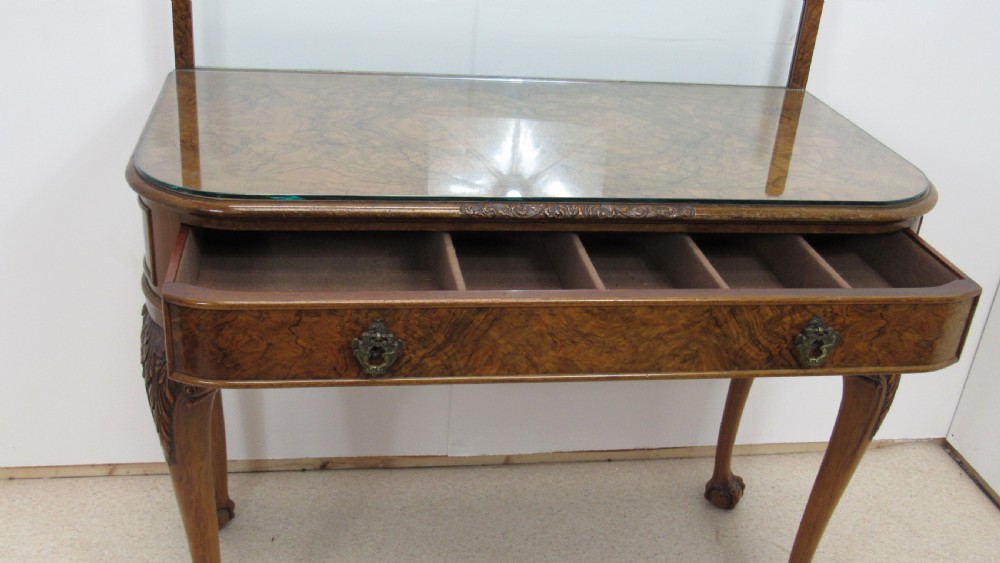 An antique burr walnut side table featuring cabriole legs with claw and ball feet, a single drawer, and a fitted glass top insert. View VI