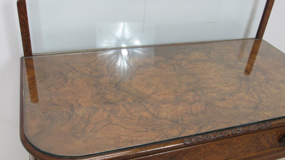 An antique burr walnut side table featuring cabriole legs with claw and ball feet, a single drawer, and a fitted glass top insert. View VII