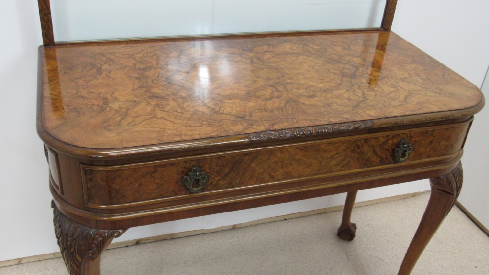 An antique burr walnut side table featuring cabriole legs with claw and ball feet, a single drawer, and a fitted glass top insert. View IX