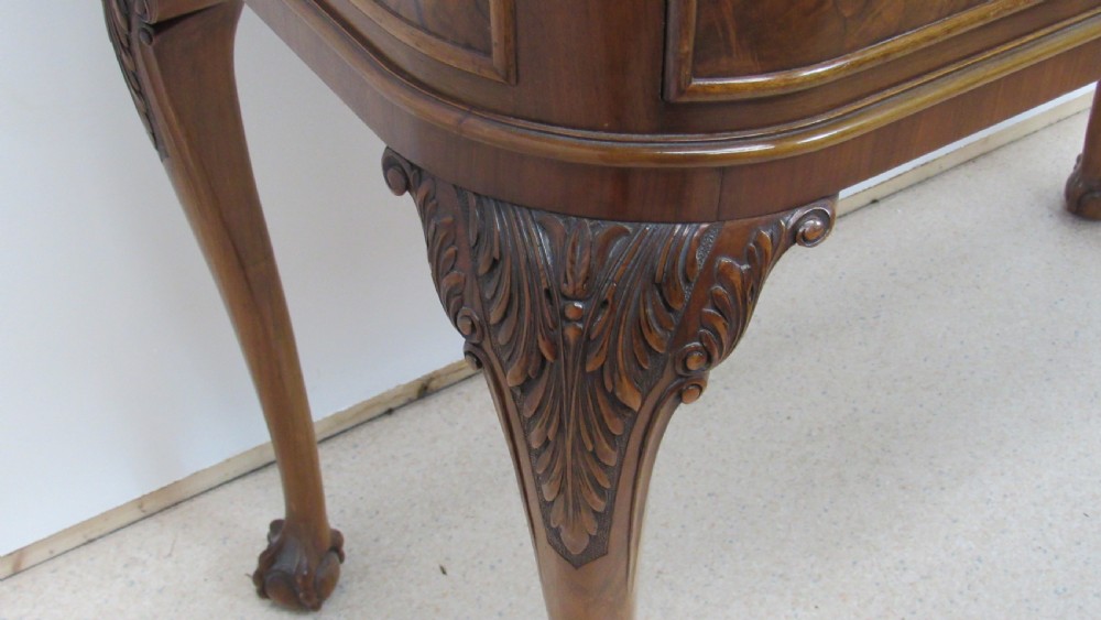 An antique burr walnut side table featuring cabriole legs with claw and ball feet, a single drawer, and a fitted glass top insert. View X