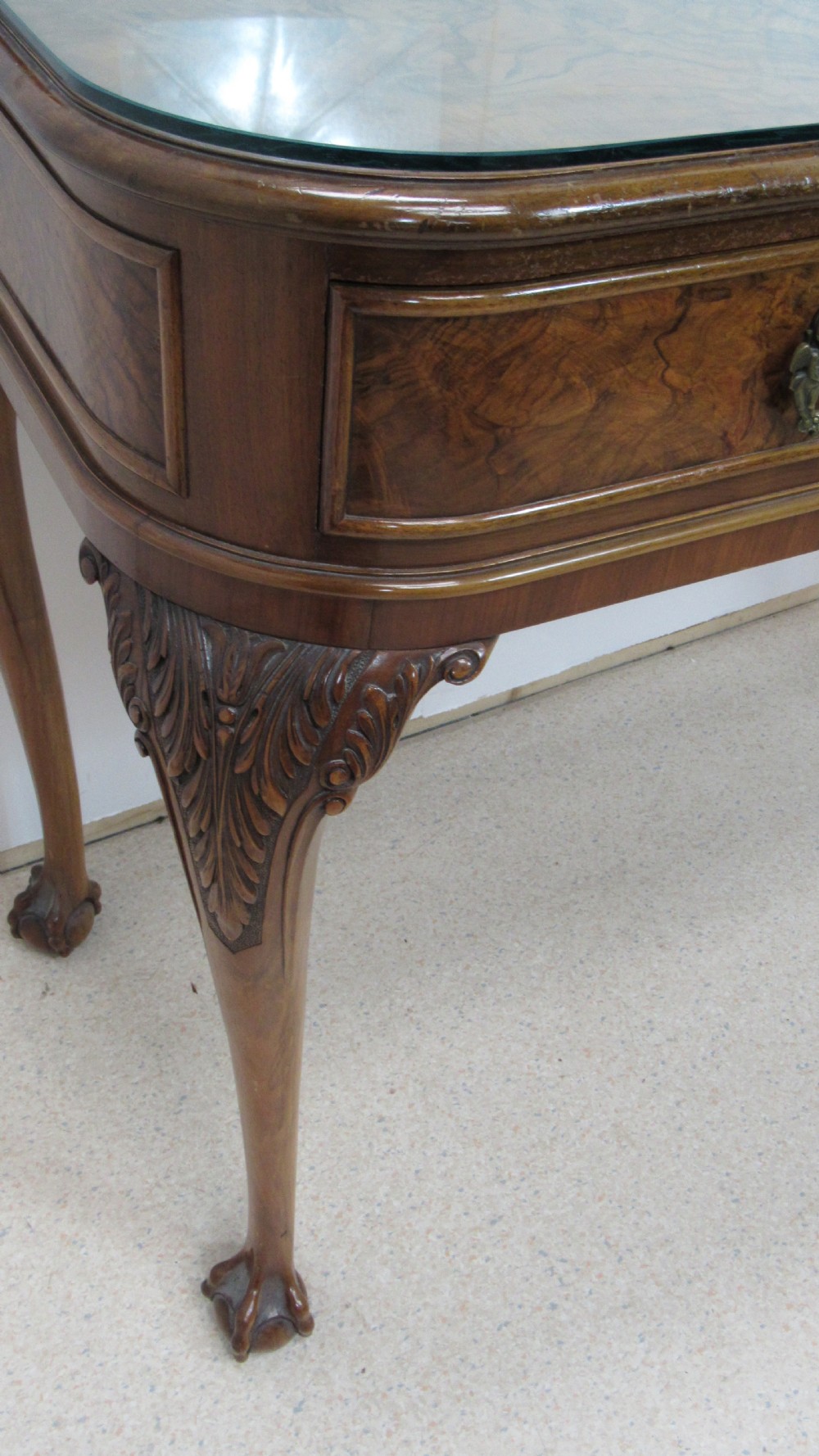 An antique burr walnut side table featuring cabriole legs with claw and ball feet, a single drawer, and a fitted glass top insert. View XV
