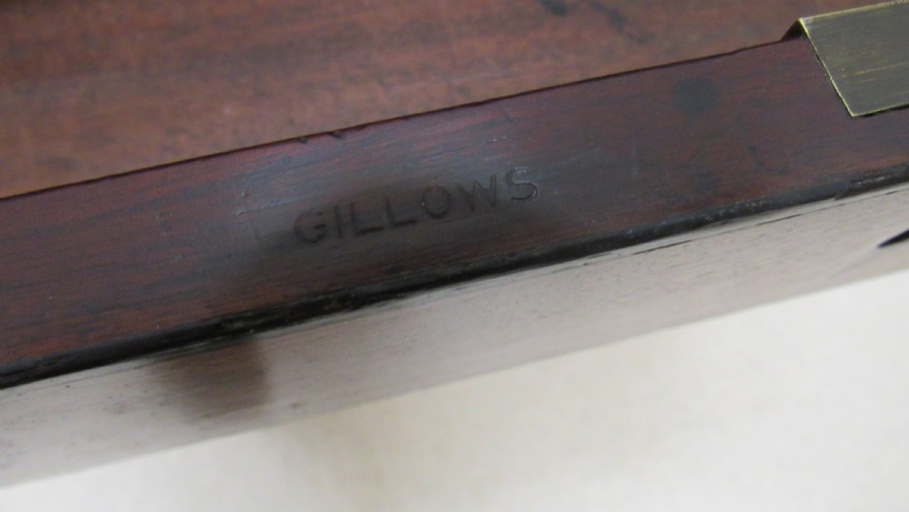 A Regency mahogany chamber table featuring reeded tapered legs on brass castors, a central drawer with wooden knobs, and a hinged lid top. View XIII