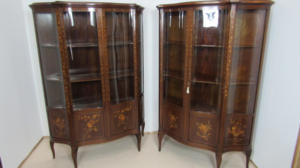 Wonderful Edwardian pair of serpentine  inlaid display cabinets  View II