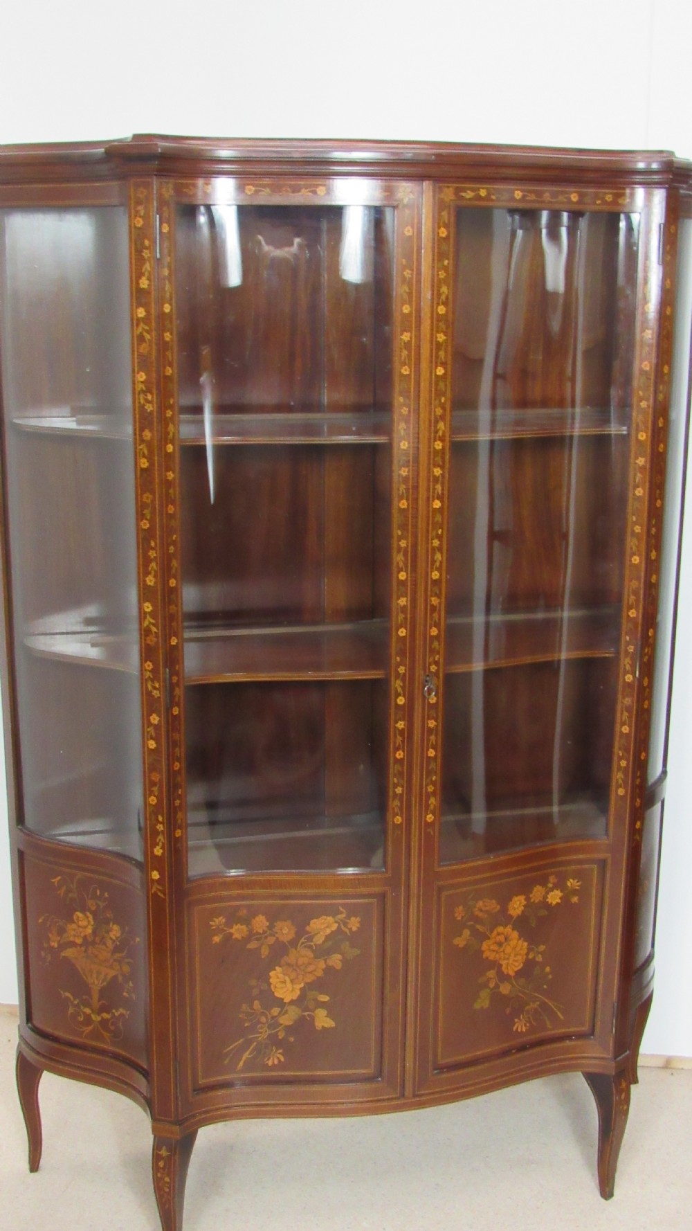 Wonderful Edwardian pair of serpentine  inlaid display cabinets  View III