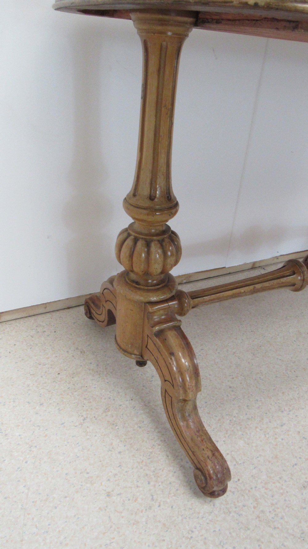 A Victorian satin walnut library table featuring a rectangular top with rounded corners, a pulled-out frieze drawer, turned pedestal legs, and a low central stretcher base. View VII