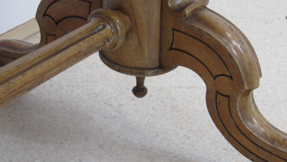 A Victorian satin walnut library table featuring a rectangular top with rounded corners, a pulled-out frieze drawer, turned pedestal legs, and a low central stretcher base. View XI