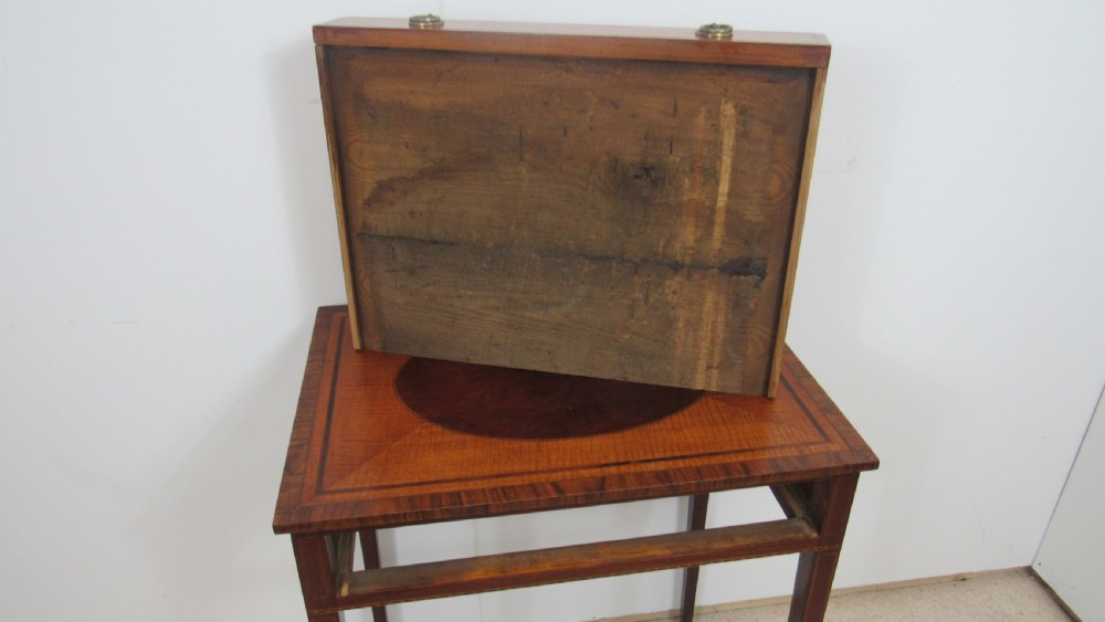 A 19th-century wooden side table featuring square tapered legs, a single drawer with brass handles, and a decorative oval inlaid top surface. View XIII