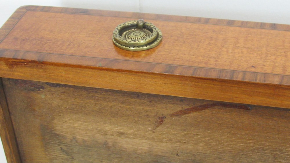 A 19th-century wooden side table featuring square tapered legs, a single drawer with brass handles, and a decorative oval inlaid top surface. View XV