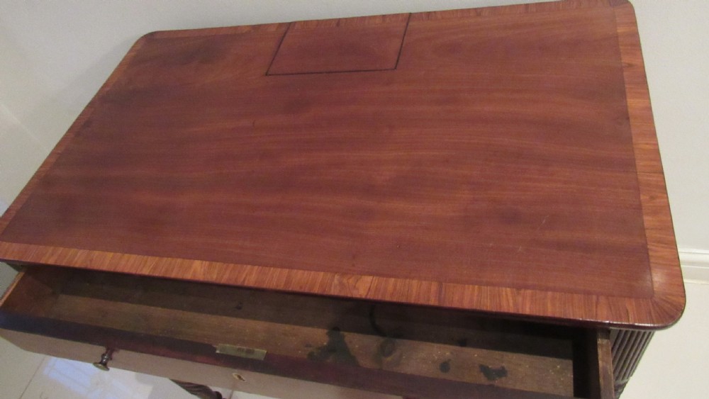 A Georgian mahogany chamber table featuring a rectangular top with a central flap, a single frieze drawer with brass hardware, and spiral turned legs on brass castors. View VIII
