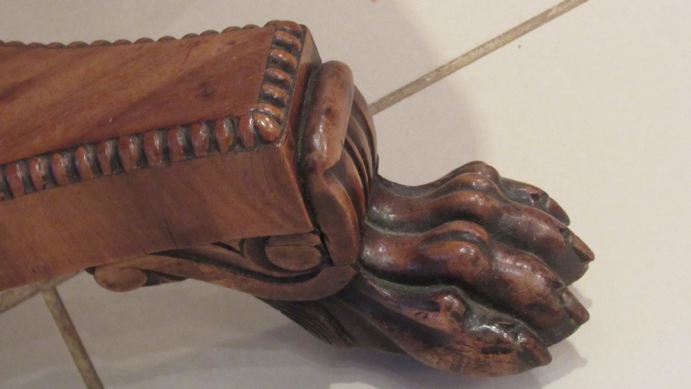A William IV flame mahogany work table featuring drop-leaf side flaps, drawers with keyholes, a pleated pink fabric work well, and a quadruped base with carved paw feet. View IX