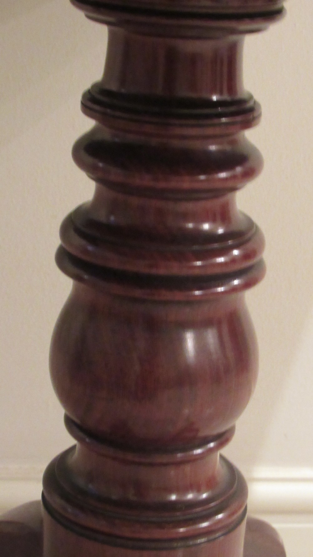 A Regency mahogany side table featuring a rectangular top with rounded corners, a central turned stem, and splayed legs with brass castors. View VIII
