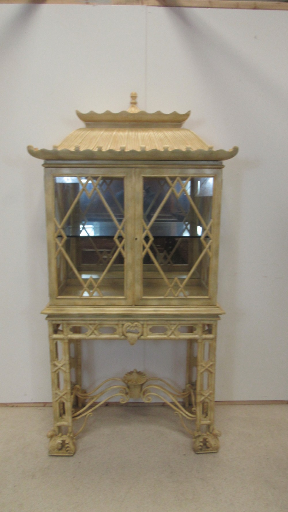 A cream painted Chinoiserie display cabinet on a stand featuring a pagoda-style roof, diamond lattice glass doors, and faux bamboo detailing. View III