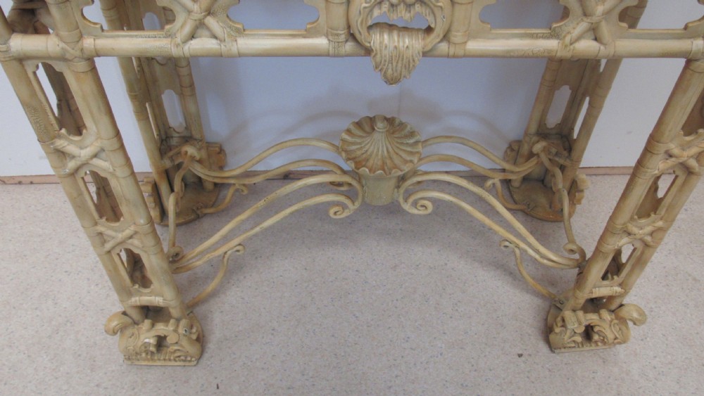 A cream painted Chinoiserie display cabinet on a stand featuring a pagoda-style roof, diamond lattice glass doors, and faux bamboo detailing. View XIV