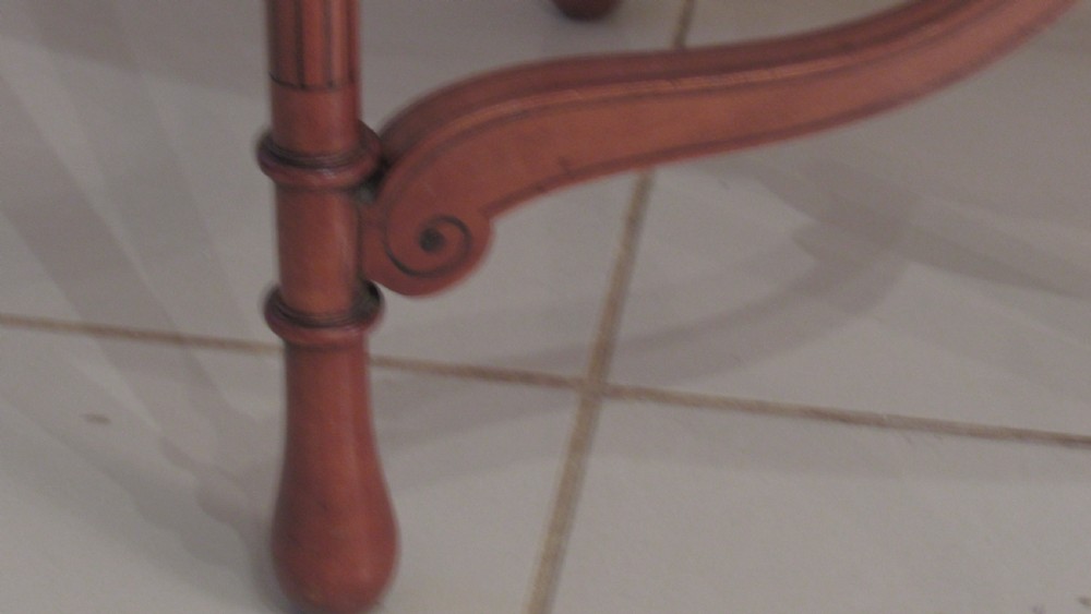 An oval antique satinwood occasional table featuring decorative marquetry inlay on top, tapered legs, and a small lower shelf with a brass gallery rail. View IX