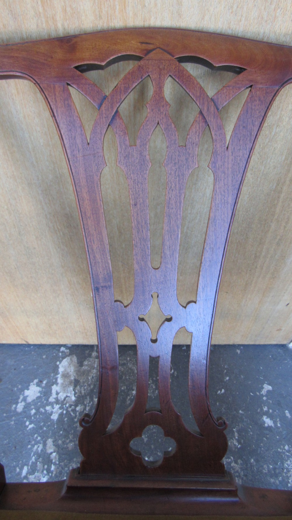 Set of four Georgian mahogany dining chairs featuring carved pierced splats and green velvet upholstered seats. View V