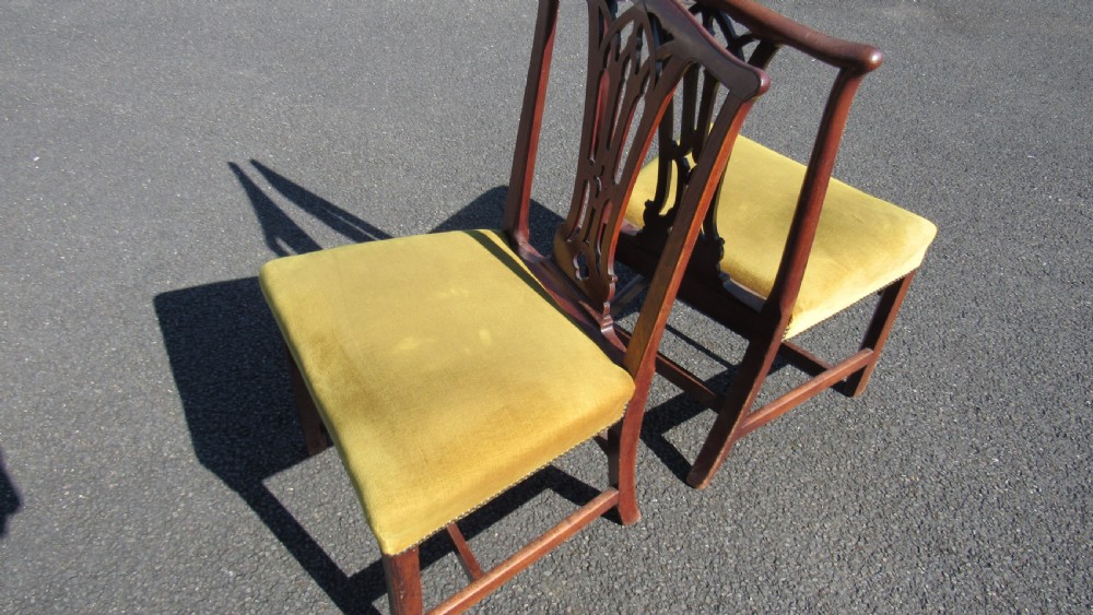 Set of four Georgian mahogany dining chairs featuring carved pierced splats and green velvet upholstered seats. View XIII