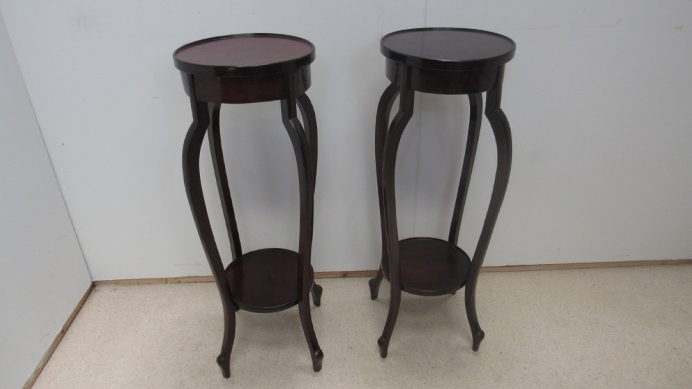 Pair of mahogany jardiniere stands