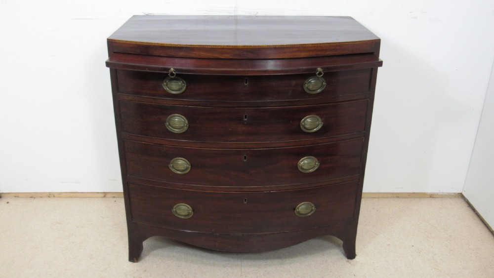 Elegant small bow front chest with a brushing slide View II