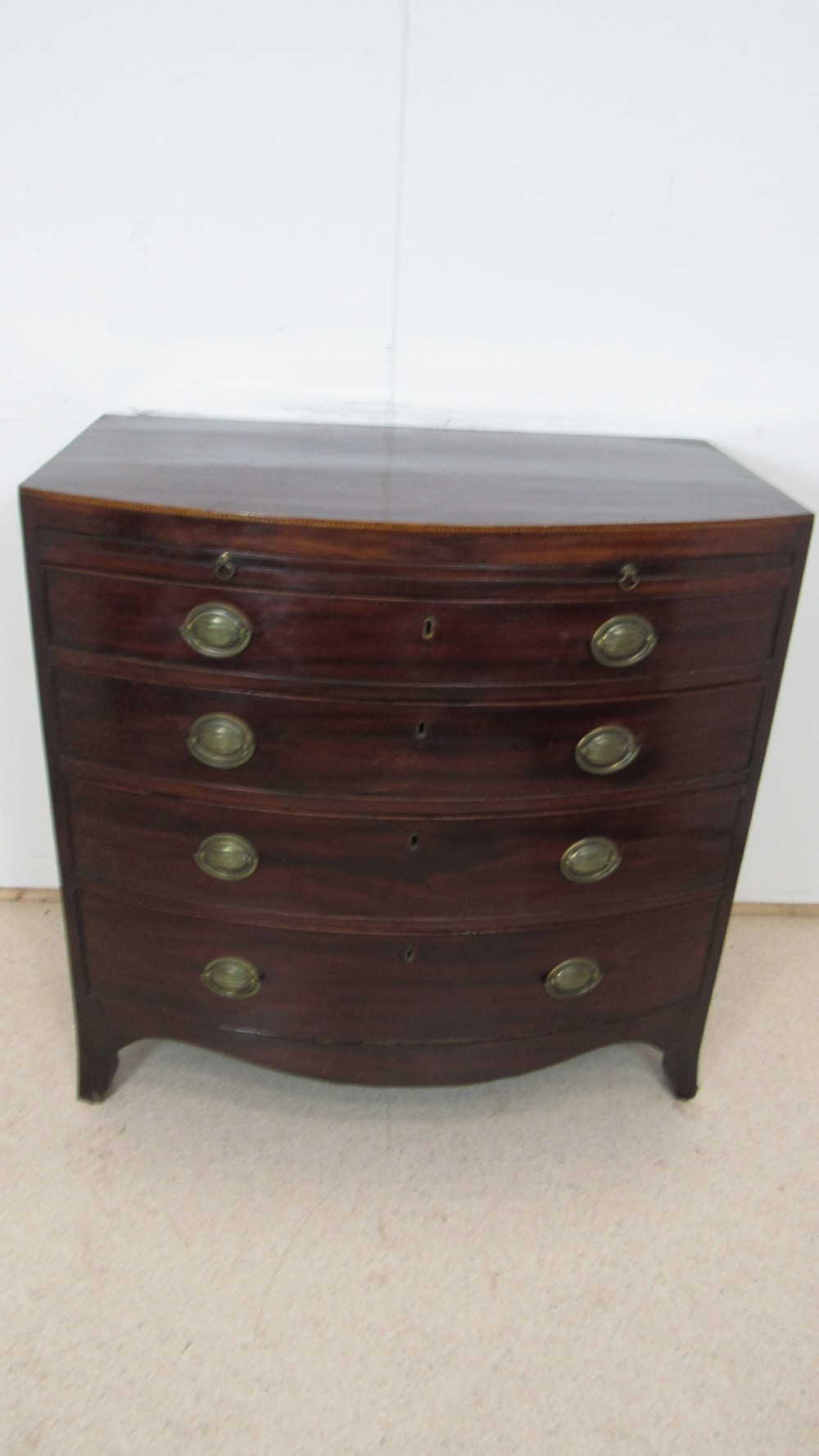 Elegant small bow front chest with a brushing slide View IX