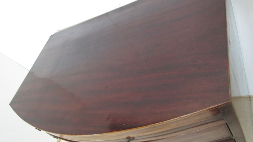 Elegant small bow front chest with a brushing slide View XI