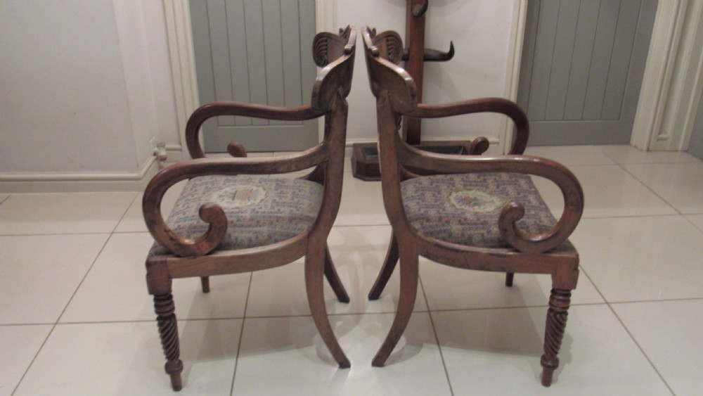 Pair of Regency mahogany carver chairs featuring curved scroll arms, reeded front legs, and patterned fabric seat upholstery. View XIV
