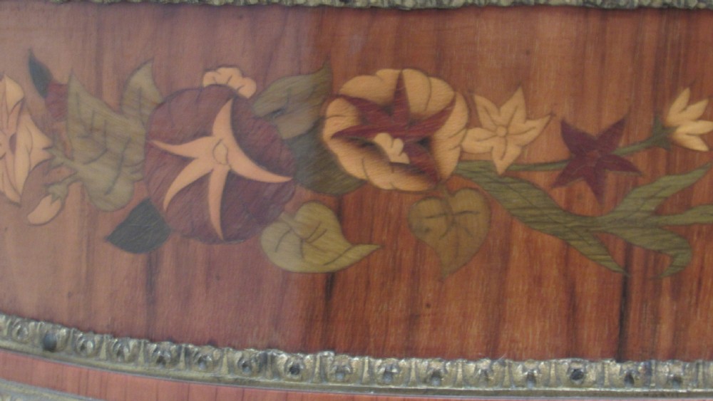 A Victorian serpentine-front credenza featuring central floral marquetry doors, glass display side cupboards, and ornate gilt-bronze mounts. View VI