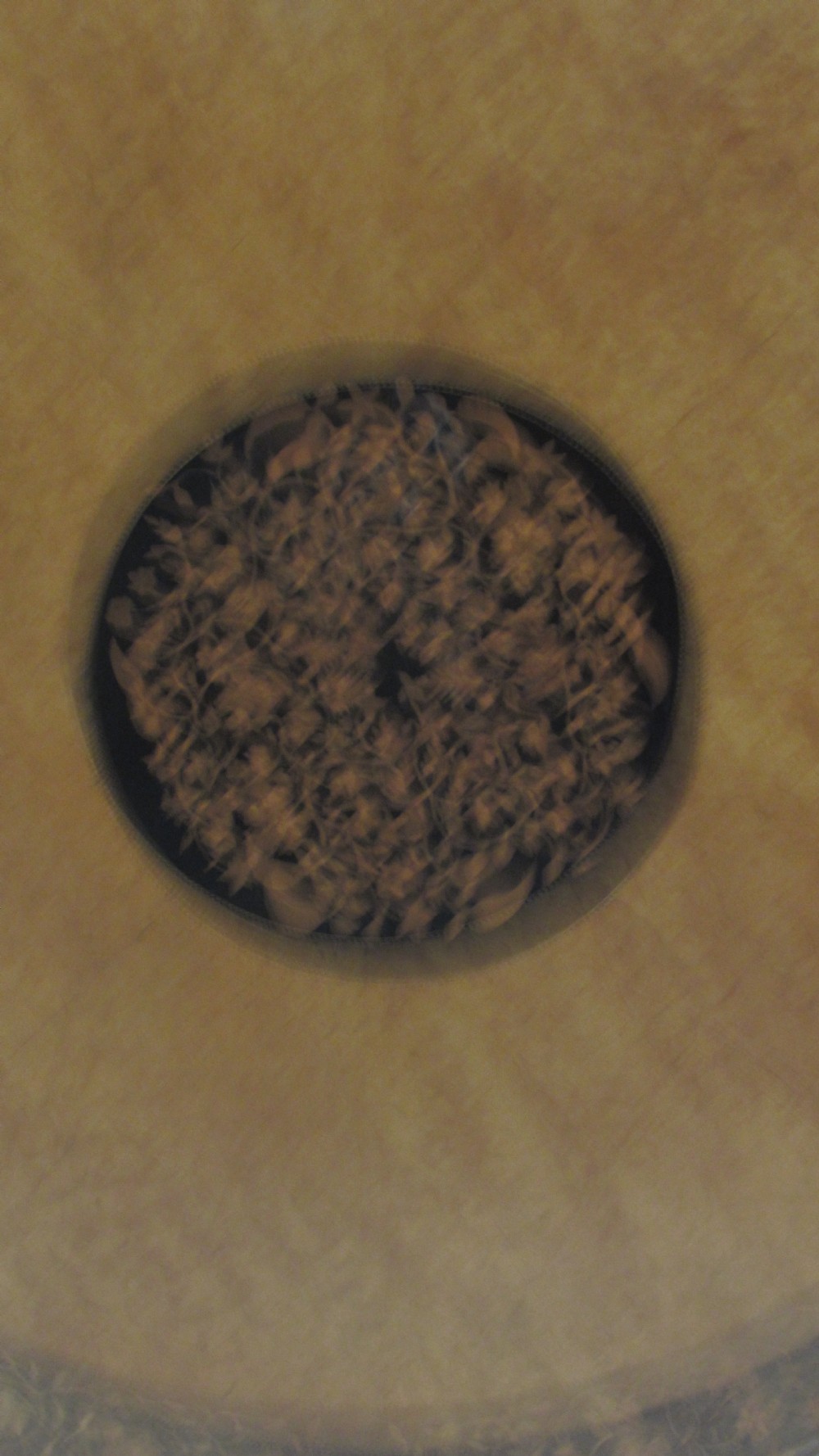 A circular Victorian walnut occasional table featuring intricate floral marquetry inlay along the border and central medallion, supported on a carved tripod pedestal base. View IX