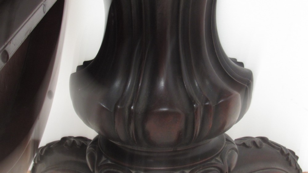 A circular Victorian walnut occasional table featuring intricate floral marquetry inlay along the border and central medallion, supported on a carved tripod pedestal base. View XII