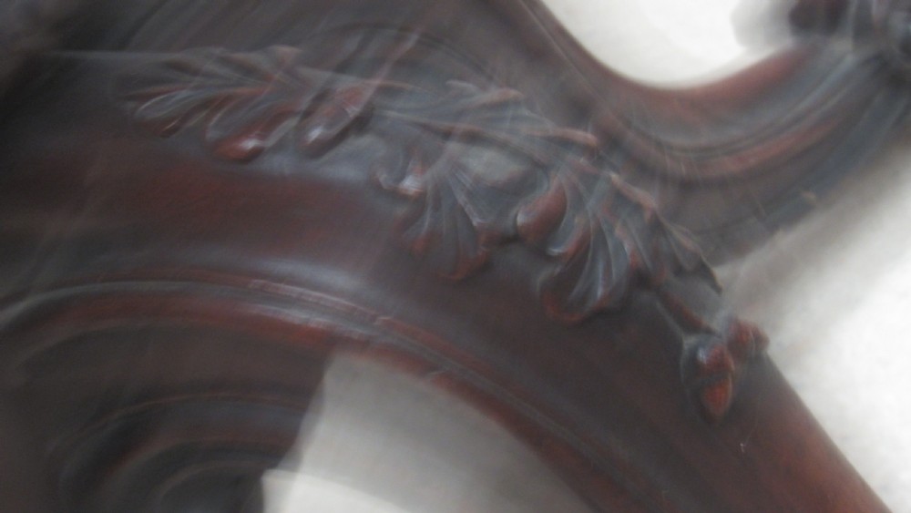 A circular Victorian walnut occasional table featuring intricate floral marquetry inlay along the border and central medallion, supported on a carved tripod pedestal base. View XIII