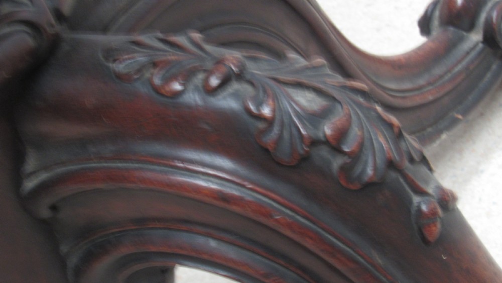 A circular Victorian walnut occasional table featuring intricate floral marquetry inlay along the border and central medallion, supported on a carved tripod pedestal base. View XIV