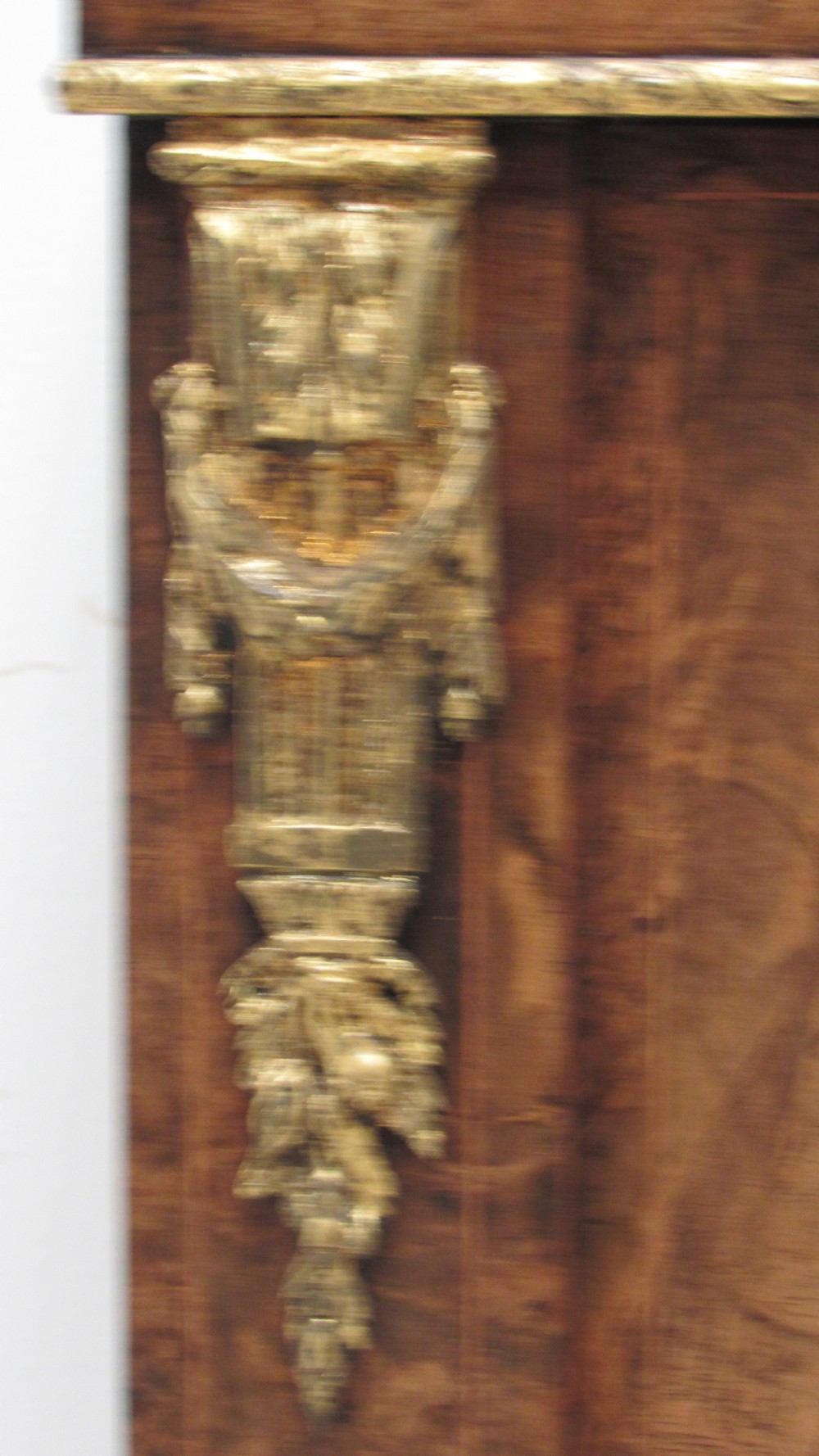 A 19th-century Victorian burr walnut pier cabinet featuring floral marquetry inlay, glazed double doors, glass shelves, and gilt brass corner mounts. View VI