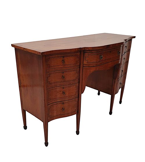 A FINE EDWARDIAN INLAID SERPENTINE SIDEBOARD
