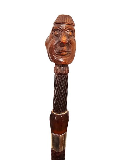 A VERY RARE 19TH CENTURY GADGET NUT CRACKER WALKING CANE WITH A PAIR OF CARVED HEADS - ADDITIONAL PHOTO 1