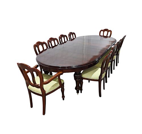 fig 1. A restored 19th-century dark mahogany extending D-end dining table supported by turned and carved legs with brass castors.