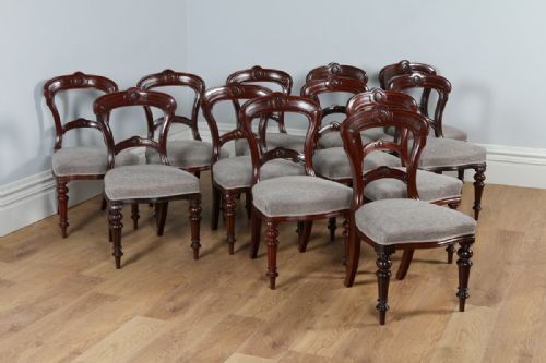 Victorian Set of 12 Twelve Mahogany Carved Back Upholstered Dining Chairs Attributable to James Shoolbred & Co. (Circa 1880)