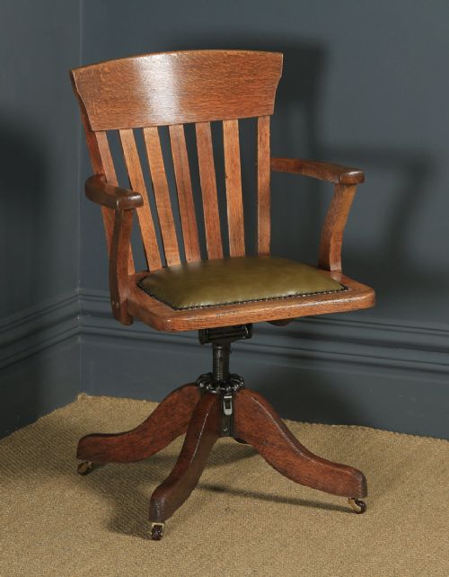 Antique American Edwardian Oak & Green Leather Revolving Office Desk Arm Chair by Heywood Brothers & Wakefield Co., (Circa 1910)
