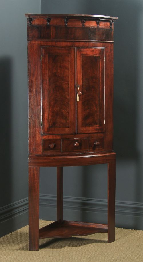 Antique English Georgian Flame Mahogany Floor Standing Bow Front Corner Cupboard on Stand (Circa 1820)