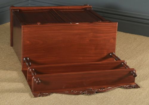 fig 2. A Regency mahogany two-door chiffonier cabinet featuring tiered upper display shelves, carved scroll cresting, and turned legs.