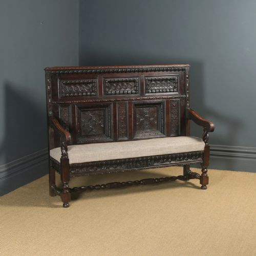Antique English 17th Century Style Victorian Oak Carved High Back Panelled Upholstered Settle (Circa 1870)