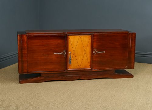 fig 1. An Art Deco mahogany sideboard featuring a serpentine front, central diamond parquetry door in maple, and streamlined metal handles.