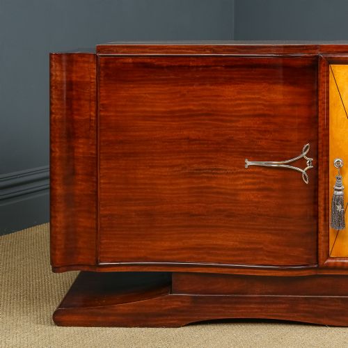 fig 2. An Art Deco mahogany sideboard featuring a serpentine front, central diamond parquetry door in maple, and streamlined metal handles.