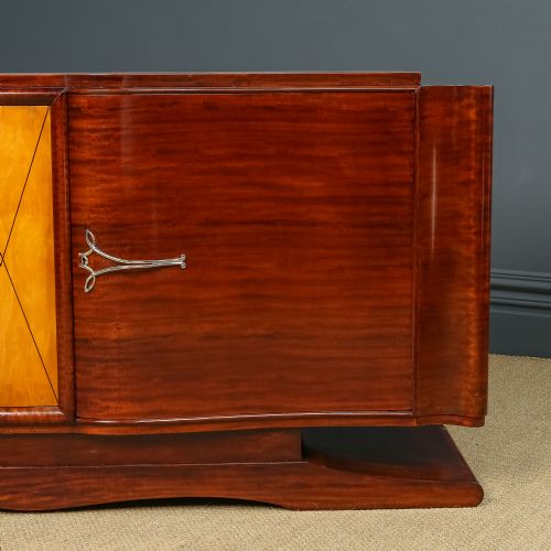 fig 4. An Art Deco mahogany sideboard featuring a serpentine front, central diamond parquetry door in maple, and streamlined metal handles.