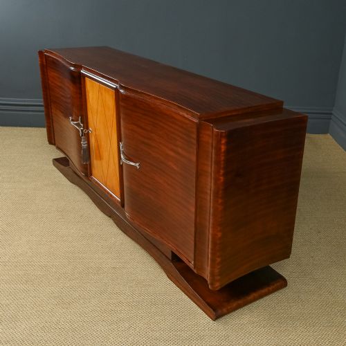 fig 5. An Art Deco mahogany sideboard featuring a serpentine front, central diamond parquetry door in maple, and streamlined metal handles.